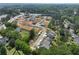 Aerial shot of a new home community featuring tree-lined streets and spacious lots at 120 Winsome Way, Woodstock, GA 30188