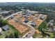New construction homes sit on spacious lots in a neighborhood surrounded by lush greenery at 120 Winsome Way, Woodstock, GA 30188
