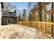Back deck showcases wooden plank flooring and railing overlooking scenic trees and natural surroundings at 270 Boulder Dr, Roswell, GA 30075