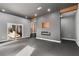 View of finished basement with gray carpet, stairs, sliding glass doors, fireplace and wooden beam details at 270 Boulder Dr, Roswell, GA 30075
