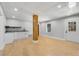 Finished basement with a bar, hardwood floors, and lots of light at 270 Boulder Dr, Roswell, GA 30075