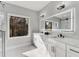 Modern bathroom with double vanity, marble countertops, and backlit mirror at 270 Boulder Dr, Roswell, GA 30075