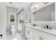 Bathroom featuring a glass shower, double sinks, and modern lighting at 270 Boulder Dr, Roswell, GA 30075