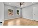Bright bedroom with wood floors, ceiling fan, neutral walls, and windows providing natural light at 270 Boulder Dr, Roswell, GA 30075