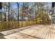 Spacious wooden deck with railings provides amazing views of trees, nature, and surrounding landscape at 270 Boulder Dr, Roswell, GA 30075