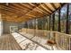 Large wooden deck showing forest views, light streaming on the wood, and exterior side of house at 270 Boulder Dr, Roswell, GA 30075