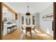 Cozy dining area with natural light, stylish lighting fixture and hardwood flooring at 270 Boulder Dr, Roswell, GA 30075
