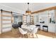 Open concept dining area with modern table and chairs with hardwood flooring at 270 Boulder Dr, Roswell, GA 30075
