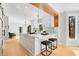 Bright kitchen with white cabinets, quartz countertops, and modern lighting fixtures at 270 Boulder Dr, Roswell, GA 30075