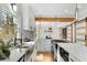 Modern kitchen with stainless steel appliances, white cabinets, and quartz countertops at 270 Boulder Dr, Roswell, GA 30075