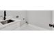 Laundry room features a stainless steel sink, white cabinets, and a faucet at 270 Boulder Dr, Roswell, GA 30075
