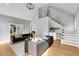 Open living room with high ceilings, hardwood floors, and staircase at 270 Boulder Dr, Roswell, GA 30075