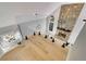 Open view of living room featuring stone fireplace, hardwood floors, and glass balcony at 270 Boulder Dr, Roswell, GA 30075