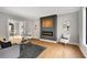 Comfortable living room featuring modern fireplace, hardwood floors and neutral decor at 270 Boulder Dr, Roswell, GA 30075