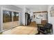 Open-concept living space with hardwood floors, sliding glass doors to deck, and adjoining modern kitchen at 270 Boulder Dr, Roswell, GA 30075