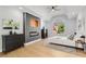 Beautifully decorated main bedroom with lots of light, wood floors, and a fireplace at 270 Boulder Dr, Roswell, GA 30075