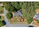 Aerial view of a well-maintained home with mature trees and lush landscaping in a quiet neighborhood at 2009 Westside Ln, Woodstock, GA 30189