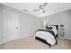 Simple bedroom with a comfy bed, neutral walls, and contemporary ceiling fan at 2009 Westside Ln, Woodstock, GA 30189