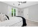 Cozy bedroom features neutral tones, a large window, and closet space at 2009 Westside Ln, Woodstock, GA 30189