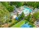 Community pool area featuring a large pool, area, slide, and gazebo surrounded by lush trees at 2009 Westside Ln, Woodstock, GA 30189