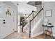 Welcoming foyer features stairs and views into the dining room, creating an inviting entrance at 2009 Westside Ln, Woodstock, GA 30189