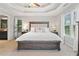 Spacious main bedroom suite boasts a king bed, elegant decor, and an ensuite bathroom at 2009 Westside Ln, Woodstock, GA 30189