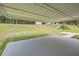 A covered back patio overlooking a spacious backyard with mature trees and a shed at 2714 Preston Dr, Decatur, GA 30034