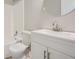 This is a simple, modern bathroom that includes a shower/tub, toilet, sink, and round mirror at 2714 Preston Dr, Decatur, GA 30034