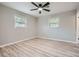 Bedroom with hardwood floors, neutral walls, ceiling fan and two windows at 2714 Preston Dr, Decatur, GA 30034