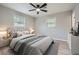 Staged bedroom with hardwood floors, neutral walls, and ceiling fan at 2714 Preston Dr, Decatur, GA 30034