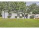 Classic brick home with well-maintained lawn and modern, dark-trimmed accents at 2714 Preston Dr, Decatur, GA 30034