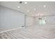 Bright, spacious living room with luxury vinyl plank floors and modern recessed lighting at 2714 Preston Dr, Decatur, GA 30034