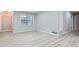 Open living space with LVP flooring, window, and neutral wall color at 2714 Preston Dr, Decatur, GA 30034