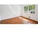 Bright bedroom with hardwood floors and natural light from the large windows at 5935 Christopher Ln, Lithonia, GA 30058