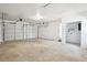 Spacious garage with two overhead doors and storage space at 5935 Christopher Ln, Lithonia, GA 30058