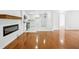 View of the transition to the kitchen featuring an electric fireplace and hardwood floors at 5935 Christopher Ln, Lithonia, GA 30058