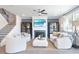 Bright living room with fireplace, large windows, and plush seating at 6180 Misty Hill Ln, Buford, GA 30518