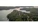 A bird's eye view displays the lake and tree-lined homesites at 171 Basil Street Dr, Cumming, GA 30040