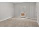 This bedroom features neutral carpet and a door to the backyard at 171 Basil Street Dr, Cumming, GA 30040