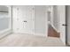 This bedroom has neutral carpet and double doors to a closet at 171 Basil Street Dr, Cumming, GA 30040