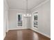 Dining room featuring hardwood floors, modern lighting, and large windows for ample natural light at 171 Basil Street Dr, Cumming, GA 30040