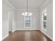Inviting dining room with hardwood floors, contemporary lighting, and bright natural light at 171 Basil Street Dr, Cumming, GA 30040