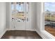 Bright entryway featuring dark wood floors, French doors, and a large window, offering plenty of natural light at 171 Basil Street Dr, Cumming, GA 30040