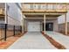 A spacious two car garage with a large driveway offers ample parking and storage space at 171 Basil Street Dr, Cumming, GA 30040