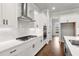 Well-equipped kitchen featuring modern appliances, ample counter space, and sleek cabinetry at 171 Basil Street Dr, Cumming, GA 30040