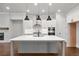 Elegant kitchen with a large central island, stainless steel appliances, and custom cabinetry at 171 Basil Street Dr, Cumming, GA 30040