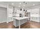 Modern kitchen with a large island and ample countertop space at 171 Basil Street Dr, Cumming, GA 30040