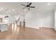Spacious living room with an open layout, hardwood flooring, and modern finishes at 171 Basil Street Dr, Cumming, GA 30040