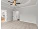Spacious main bedroom with neutral carpeting, a ceiling fan, and ensuite access at 171 Basil Street Dr, Cumming, GA 30040