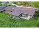 Aerial view of charming brick home with spacious back yard and screened-in porch at 2027 Kensington High Sw St, Lilburn, GA 30047